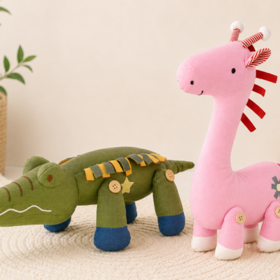 Two stuffed animal toys—a pink giraffe and a green alligator—stand on a circular woven rug in a cozy playroom setting.